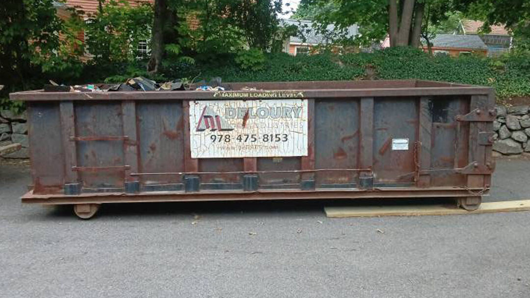 Deloury Dumpster Rental provided this 15-yard, 3-ton max dumpster for a roofing and demo project in Lawrence, MA. Keep your construction site clean!