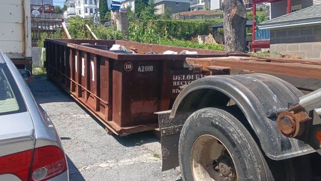 20-yard dumpster picked up after a residential remodeling project in Lawrence, MA